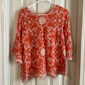 Top with embroidered detail.